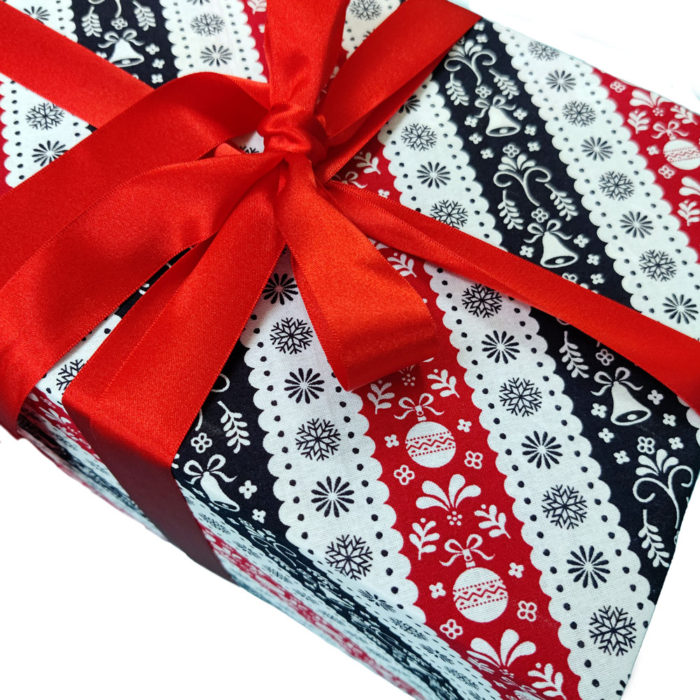 Christmas Gift wrapped in Red, White and Navy Blue Scandi Stripe Cloth Wrapping with Red Ribbon